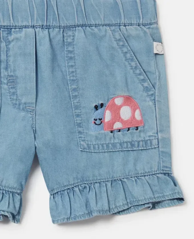 Denimshorts med broderad nyckelpiga