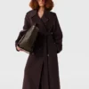 Dubbelvävd trenchcoat med bälte Dubbelvävd trenchcoat med bälte