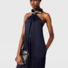 Halterneck-overall i satin med kulkedja Halterneck-overall i satin med kulkedja