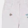 Jeans med broderad blomma