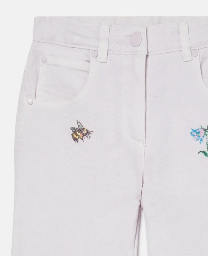 Jeans med broderad blomma