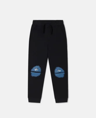 Joggingbyxor med monsterknäplåster