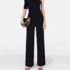 Kompakt stickad jumpsuit med en axel