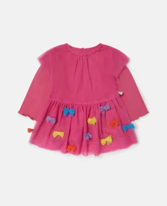 Långärmad klänning med broderad rosett
