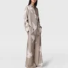 Oversized byxor med dragsko och duvtryck Oversized byxor med dragsko och duvtryck