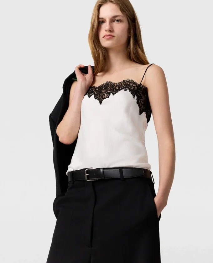 Ärmlös topp i spets och satin Ärmlös topp i spets och satin