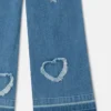 Stretchjeans med fransade hjärtlapper