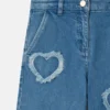 Stretchjeans med fransade hjärtlapper
