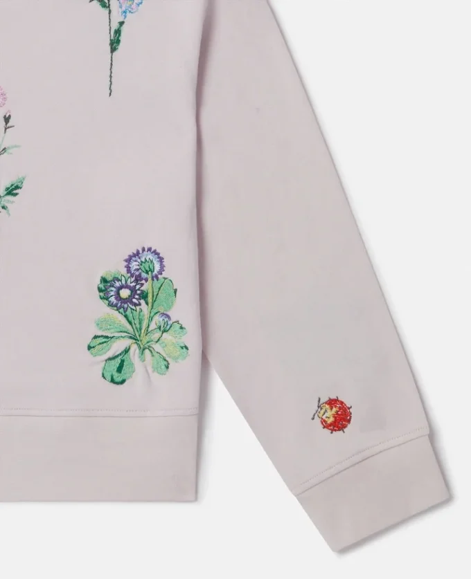 Sweatshirt med broderad blomma